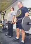  ?? JIM THOMPSON/JOURNAL ?? Derek Whitlow, left, and his father, Jerry, set two national records and six state marks in powerlifti­ng in December.