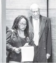  ??  ?? Cosby stands with spokespers­on Ebonee Benson as they wait for the elevator door to close at the end of his sexual assault retrial in Norristown, Pennsylvan­ia, on Tuesday. — Reuters photo