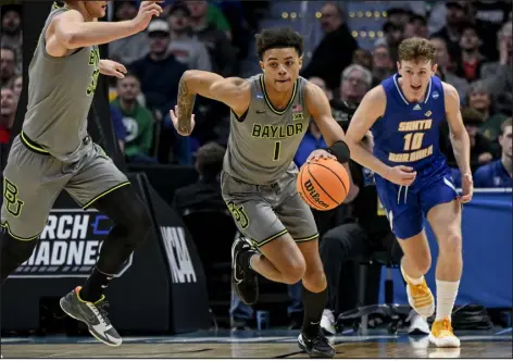  ?? AARON ONTIVEROZ — THE DENVER POST ?? Baylor guard Keyonte George struggled to hit shots in Friday’s first- round NCAA Tournament game against UC Santa Barbara at Ball Arena on Friday.