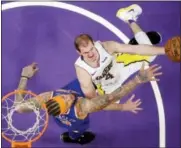  ?? MARK J. TERRILL — ASSOCIATED PRESS ?? Lakers guard Alex Caruso, right, shoots as Knicks forward Michael Beasley defends during the first half of Sunday’s game in Los Angeles.