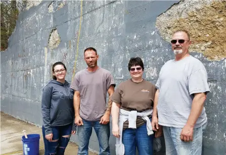  ??  ?? Above, from left, Madison Chamberlan­d, her father Jonathan, art teacher Diane Mayers and her husband Kip stand along the Cass Avenue railroad abutment that will soon be a mural. Below, a hand-drawn, black-and-white sketch of what the finished product will look like.