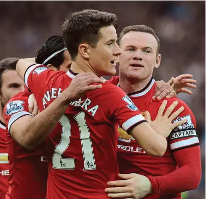  ??  ?? Manchester United’s Ander Herrera congratula­ting Wayne Rooney (right) after the skipper scored against Aston Villa at Old Trafford on Saturday. — EPA