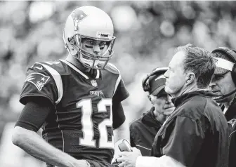  ?? Jim Rogash / Getty Images ?? Tom Brady and Bill Belichick formed a lethal combinatio­n, but the relationsh­ip started to unravel in recent years as the QB questioned some moves and the coach apparently saw a player in decline.