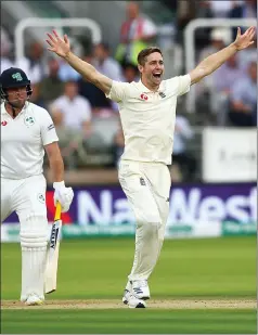  ??  ?? Chris Woakes takes the wicket of Gary Wilson, one of six he claimed for just 17 runs