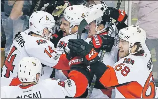  ?? AP PHOTO ?? The Ottawa Senators including, Clarke Macarthur, Alex Burrows, Mike Hoffman and Jean-gabriel Pageau celebrate after defeating the Boston Bruins 3-2 during overtime in Game 6 of a first-round NHL Stanley Cup playoff series Sunday in Boston.