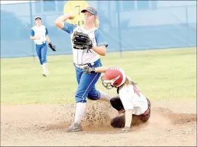  ??  ?? McDonald County’s Chloe Colvin tries to break up a double play attempt by Carthage’s Alexis Paynter during the Lady Mustangs 3-1 loss in the opening round of the district tournament on Oct. 5 at Carthage High School.