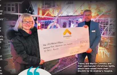  ??  ?? Tracey and Martin Connolly and their spectacula­r Christmas lights, which have raised more than £4,000 for St Andrew’s Hospice.