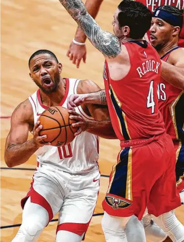  ?? Photos by Gerald Herbert / Associated Press ?? Eric Gordon, returning to the lineup after taking Monday’s game off for rest, was productive with 23 points. But JJ Redick (4) and the Pelicans were too much for the Rockets, playing their fifth game in seven nights.