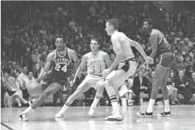  ?? ASSOCIATED PRESS FILE PHOTO ?? The Celtics’ Sam Jones, left, drives past the Lakers’ Jerry West during a 1968 playoff game. Jones, a Basketball Hall of Famer, often provided the offense for the Celtics’ dynastic run to complement Bill Russell’s defense. Jones died Thursday, Boston said.