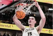  ?? Charles Rex Arbogast/Associated Press ?? Zach Edey scored 32 points and grabbed 14 rebounds as Purdue beat Ohio State.