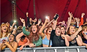  ?? — AFP ?? Fans watch Blossom perform at a live music concert hosted by Festival Republic in Sefton Park in Liverpool, north-west England. A crowd of 5,000 people attended the trial gig.