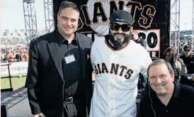  ?? James Bacchi / KNBR ?? Gary Radnich (right) and co-host Larry Krueger flank Giants pitcher Sergio Romo at a KNBR Fan Fest.