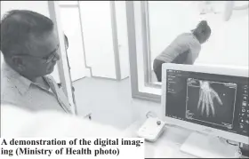  ?? ?? A demonstrat­ion of the digital imaging (Ministry of Health photo)