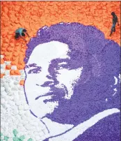  ??  ?? Artists give final touches to a paper portrait of former cricketer Sachin Tendulkar at a school in Mumbai on Tuesday. Six artists worked for 26 hours to finalise Tendulkar's portrait on the occasion of his 45th birthday.