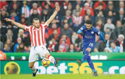  ?? — AP ?? STOKE: Leicester City’s Riyad Mahrez, right, makes an attempt on goal past Stoke City’s Erik Pieters during their English Premier League soccer match at the Bet365 Stadium, Stoke, England, yesterday.