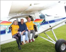  ??  ?? Irish soccer legend Paul McGrath with John and Majella Roche of Londis, Doneraile launching the ‘Jump for Joy’ parachute jump for Pieta House.