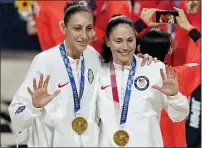  ?? CHARLIE NEIBERGALL - THE ASSOCIATED PRESS ?? The United States’ Sue Bird, right, and Diana Taurasi pose with their gold medals during the ceremony for women’s basketball at the 2020 Summer Olympics, Sunday, in Saitama, Japan.