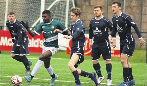  ?? Picture: Tracey Corps ?? Ashford United 3rds (green) challenged by Kingsnorth Pilgrims