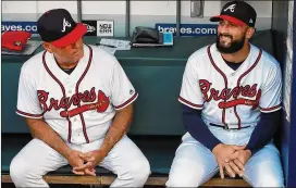  ?? CURTIS COMPTON / CCOMPTON@AJC.COM ?? Nick Markakis (right) will have a least one more season with manager Brian Snitker after getting a $6 million guaranteed deal.