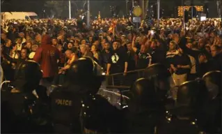  ?? DRAGAN PERKOVSKI, THE ASSOCIATED PRESS ?? Police block protesters from the parliament building in Skopje, Macedonia, on Thursday.