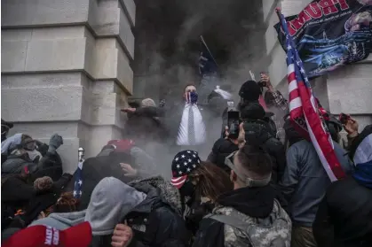  ?? ?? Trump supporters attempt to breach the capitol in Washington DC on 6 January 2021. Photograph: Victor J. Blue/Bloomberg via Getty Images