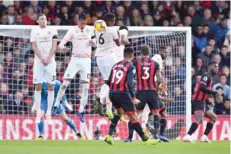  ?? — Reuters ?? Manchester United’s Nemanja Matic, Chris Smalling and Paul Pogba jump to block the ball.