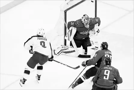  ?? COLUMBUS DISPATCH FILE PHOTO ?? Columbus Blue Jackets' Artemi Panarin scores the game-winning goal on Capitals goaltender Philipp Grubauer in overtime in Game 1 of their first-round series in Washington, D.C., last Thursday.