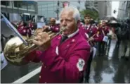  ?? CRAIG RUTTLE — THE ASSOCIATED PRESS ?? A band representi­ng Castellamm­are del Golfo, Italy, marches along Fifth Avenue in New York during the annual Columbus Day Parade.