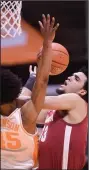  ?? (Knoxville News Sentinel via AP) ?? Alabama’s Jahvon Quinerly (right) attempts to shoot against Tennessee’s Keon Johnson in the Tide’s victory on Saturday.