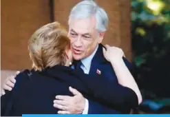  ??  ?? SANTIAGO: Chilean president elect Sebastian Pinera greets President Michelle Bachelet (left) upon arrival at his residence in Santiago yesterday. —AFP
