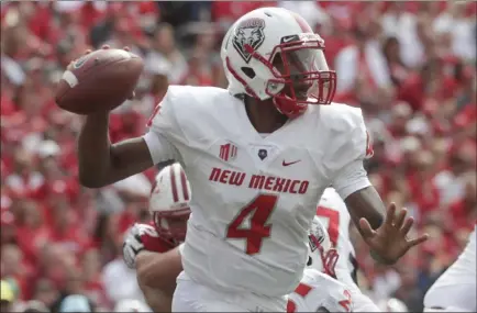  ?? Morry Gash ?? The Associated Press New Mexico’s Sheriron Jones, playing Sept. 8 in a loss at Wisconsin, nearly sparked a comeback victory against Liberty.