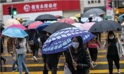  ?? Photograph: Jérôme Favre/EPA ?? People wearing face masks in Hong Kong. The WHO reviewed its position on masks in light of data from Hong Kong.