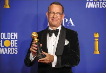  ?? ALLEN J. SCHABEN — LOS ANGELES TIMES ?? Cecil B. deMille Award-winner Tom Hanks poses in the photo deadline room at the 77th Golden Globe Awards. — Tom Hanks on artificial intelligen­ce in entertainm­ent