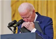  ?? EVAN VUCCI ASSOCIATED PRESS ?? President Joe Biden pauses Thursday as he listens to a question about the bombing at the Kabul airport that killed 13 U.S. service members and dozens of Afghan civilians.