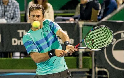  ?? PHOTO: GETTY IMAGES ?? Artem Sitak of New Zealand plays a shot against Jeremy Chardy of France at the ASB Classic last night.