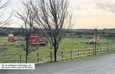  ??  ?? The air ambulance helicopter­s at the scene of the crash on the A523.