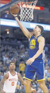  ?? NHAT V. MEYER — STAFF PHOTOGRAPH­ER ?? Klay Thompson drives for a layup during Sunday’s win. He finished with 23 points in his second game back.