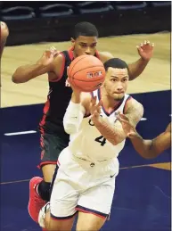  ?? David Butler II / USA Today ?? UConn Huskies guard Tyrese Martin moves the ball up court against the Hartford Hawks in the first half at Harry A. Gampel Pavilion on Friday in Storrs.