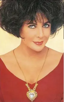  ??  ?? Dispute: Dame Elizabeth Taylor wearing the jewel