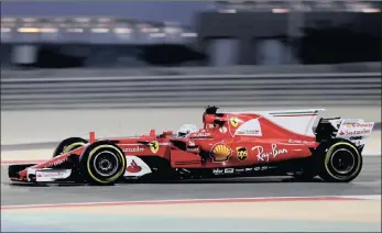  ?? PICTURE: REUTERS ?? FAST FERRARI: Sebastian Vettel on his way to posting the fastest time during the second free practice session for tomorrow’s Bahrain Grand Prix.