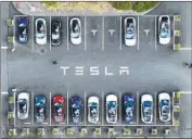  ?? Justin Sullivan Getty Images ?? TESLA, now headquarte­red in Austin, Texas, has grown to about 100,000 employees globally.