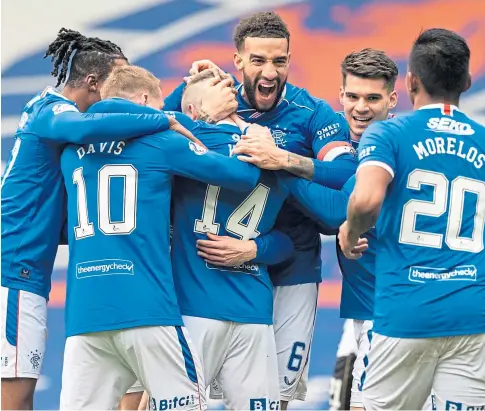  ??  ?? PARTY TIME: Rangers captain Connor Goldson at the centre of the celebratio­ns after Ryan Kent netted the opening goal in Saturday’s victory over St Mirren at Ibrox.
