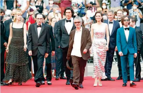  ?? Reuters ?? Director Leos Carax, stars Adam Driver, Marion Cotillard, Simon Helberg, singer Angele and musician Ron Mael arrive in Cannes on Tuesday.