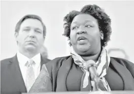  ?? CHRIS O’MEARA/AP ?? Florida Deputy Secretary for Health Dr. Shamarial Roberson, right, speaks to the media during a news conference on Monday in Tampa.