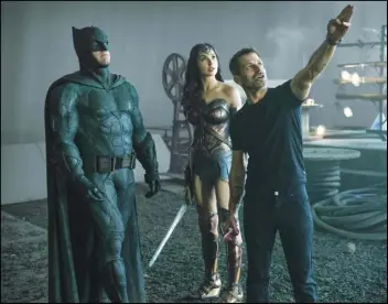  ?? CLAY ENOS/HBO MAX VIA AP ?? This image released by HBO Max shows Ben Affleck as Batman (left), Gal Gadot as Wonder Woman and director Zack Snyder on the set of “Zack Snyder’s Justice League.”