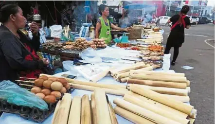  ??  ?? In Laos, khaolam is still readily available at any time of the year along roadsides and in markets. — ANN