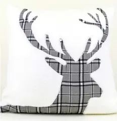  ??  ?? This holiday pillow is from the Martha Stewart Collection at Macy’s.