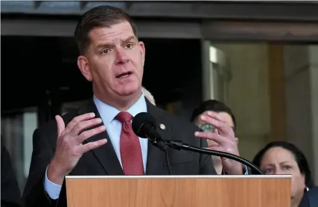  ?? JIM MICHAUD / BOSTON HERALD ?? EXPLORING ONLINE LEARNING: Mayor Martin Walsh speaks about the coronvirus emergency on Sunday in front of City Hall.