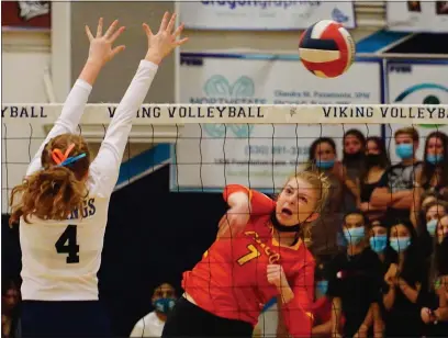  ?? PHOTOS BY DAN REIDEL — ENTERPRISE-RECORD ?? Pleasant Valley’s Emma Daugherty (4) leaps to defend a kill from Chico’s Carly McPherson (7) as the Vikings host the Panthers in a rivalry match Wednesday evening in Chico.