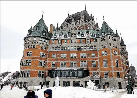  ?? St. Louis Post-Dispatch/TNS/BRIAN SIRIMATURO­S ?? Often called the most photograph­ed hotel in the world, the Fairmont Le Chateau Frontenac in Quebec City has more than 600 rooms and stands tall and proud over the St. Laurence River.